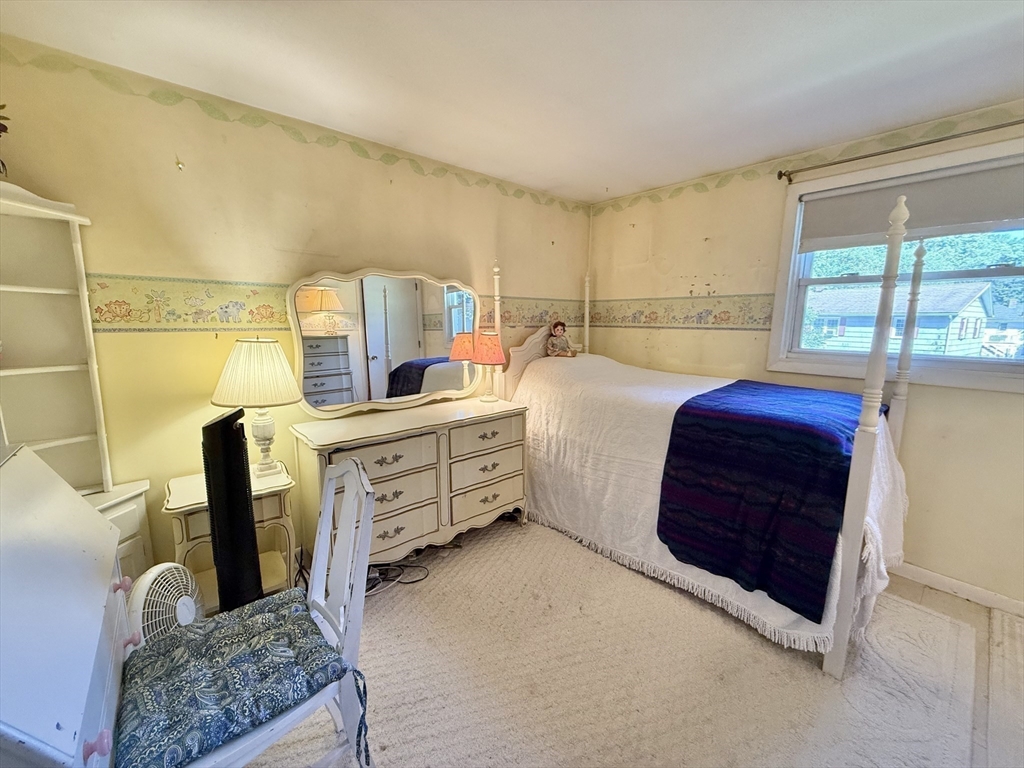 16 Meadowview Road Holyoke, MA 01040 - Photo 14 of 22 a bedroom with a bed and a dresser next to a window