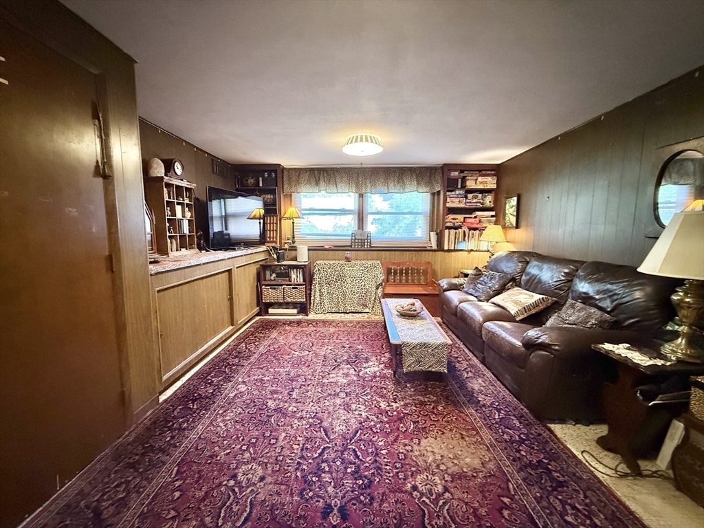 16 Meadowview Road Holyoke, MA 01040 - Photo 15 of 22 a living room with furniture and a wooden floor