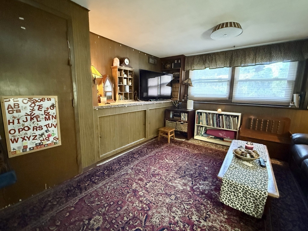16 Meadowview Road Holyoke, MA 01040 - Photo 16 of 22 a living room with a couch and a table
