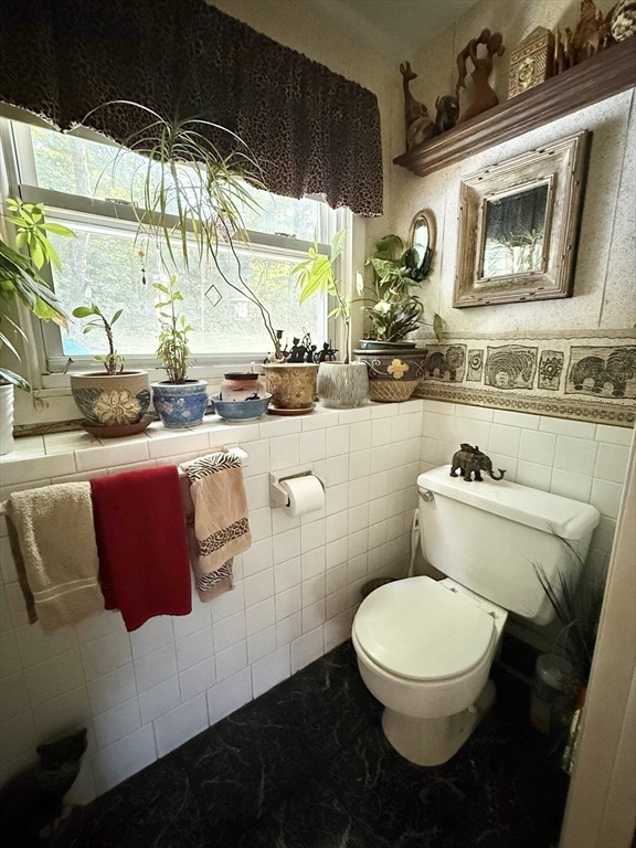 16 Meadowview Road Holyoke, MA 01040 - Photo 18 of 22 a bathroom with a toilet sink and mirror