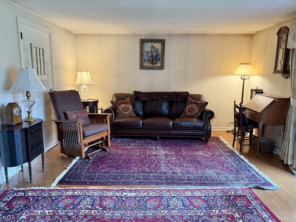16 Meadowview Road Holyoke, MA 01040 - Photo 5 of 22 a living room with furniture rug and a table
