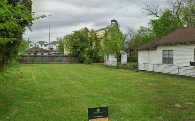 4437 Providence Street Houston, TX 77020 - Photo 3 of 10 a view of a backyard with large trees