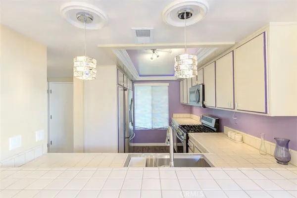 a spacious bathroom with a tub a mirror and a shower