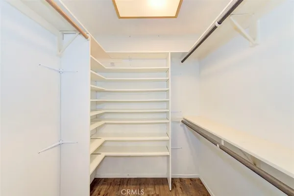 a view of staircase with white walls and a window