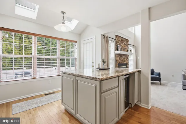 a kitchen with a sink and large window