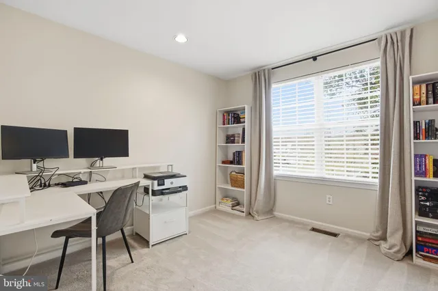 a workspace with furniture and a window