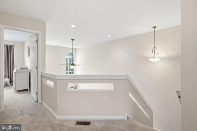 a en suite bathroom with a sink a mirror and vanity