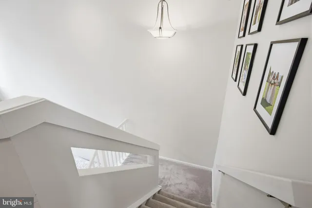 a view of staircase with white walls