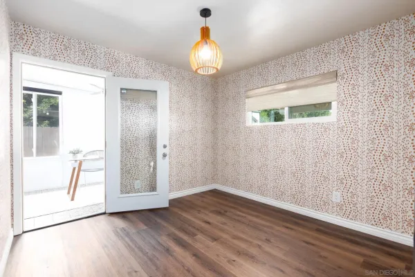 a view of room with window and ceiling fan