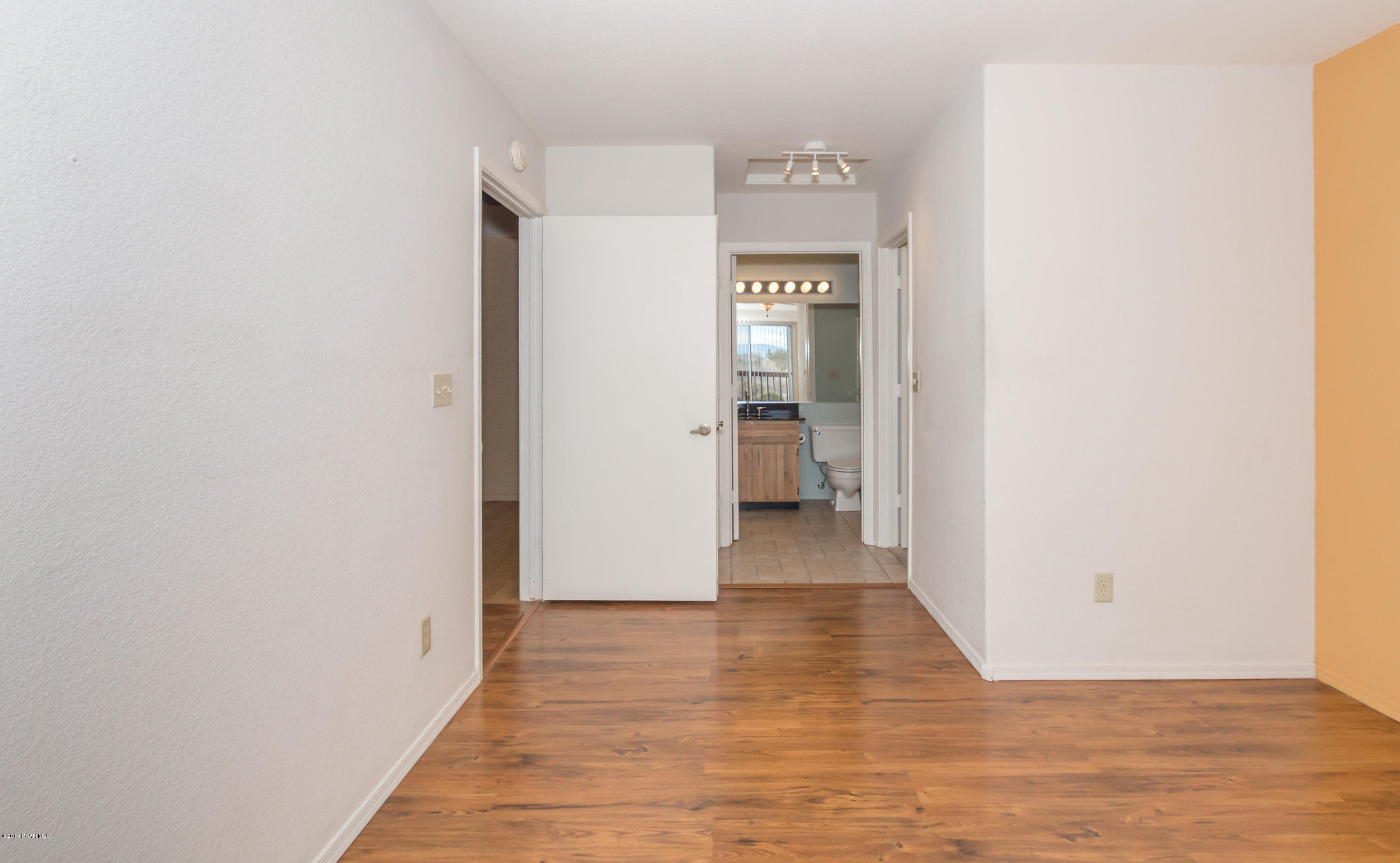 3059 Smokey Road, Unit 21B Prescott, AZ 86301 - Photo 11 of 21 a view of a hallway with wooden floor