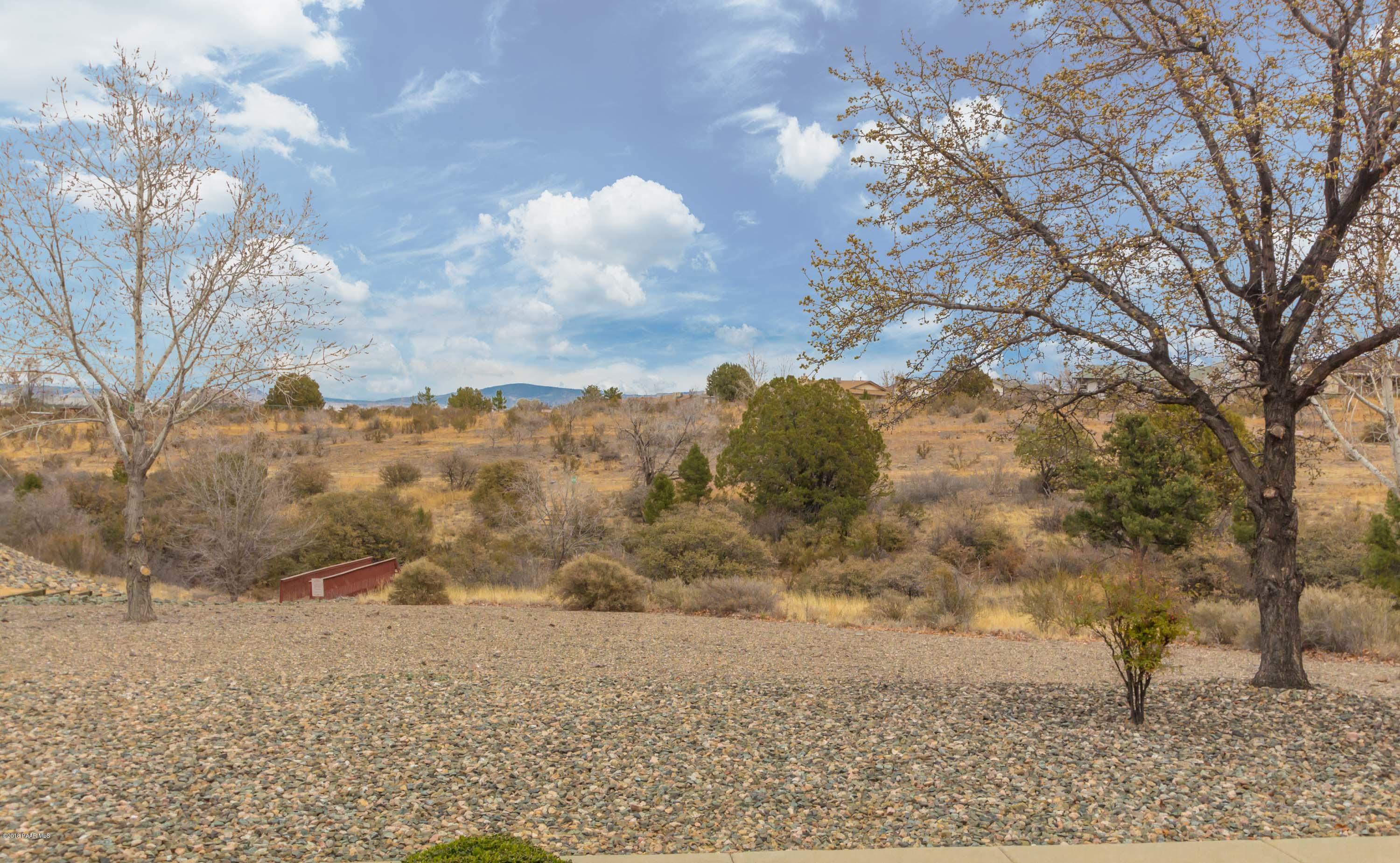 3059 Smokey Road, Unit 21B Prescott, AZ 86301 - Photo 15 of 21 a view of a dry yard with trees