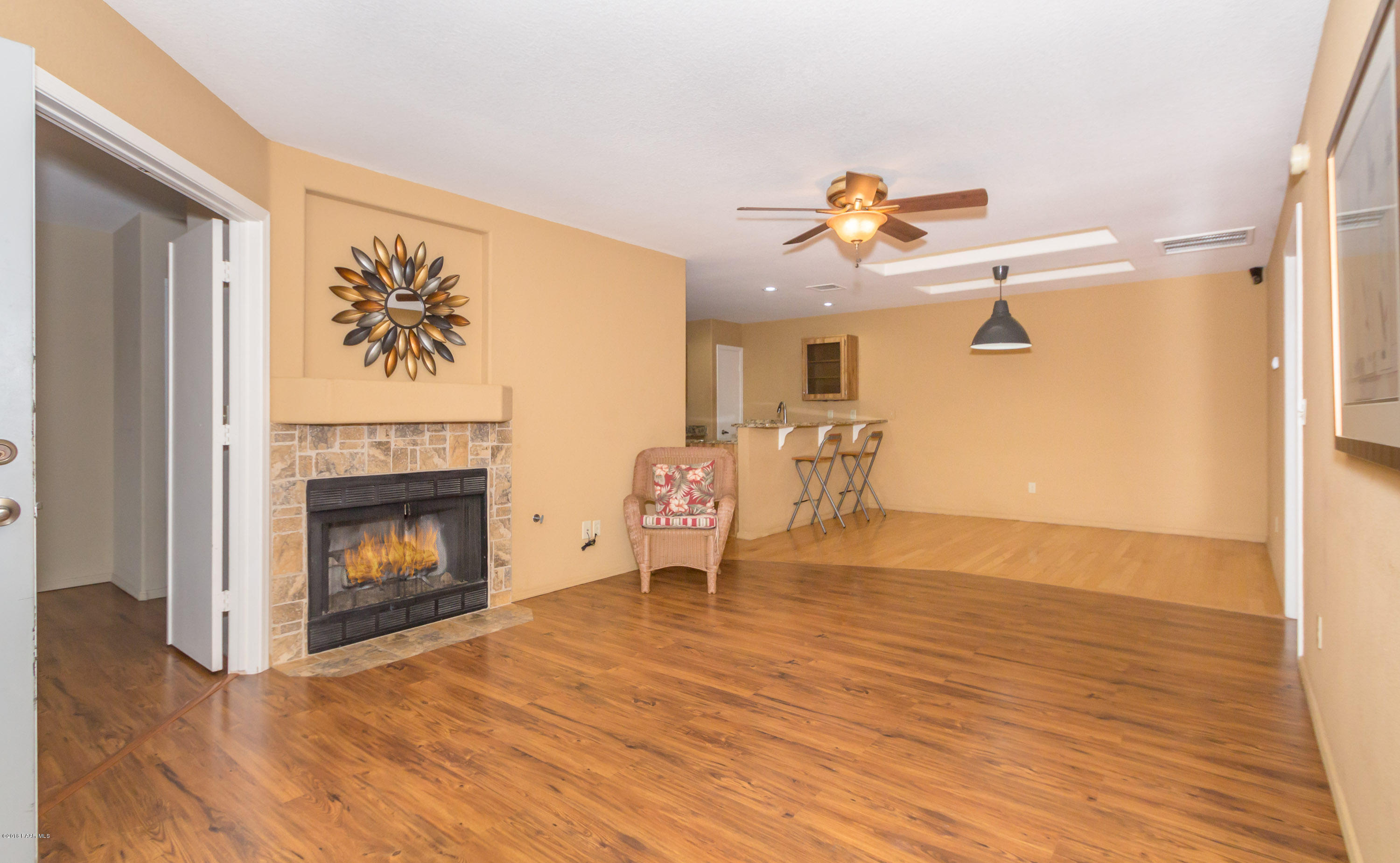 3059 Smokey Road, Unit 21B Prescott, AZ 86301 - Photo 3 of 21 a living room with furniture and a fireplace