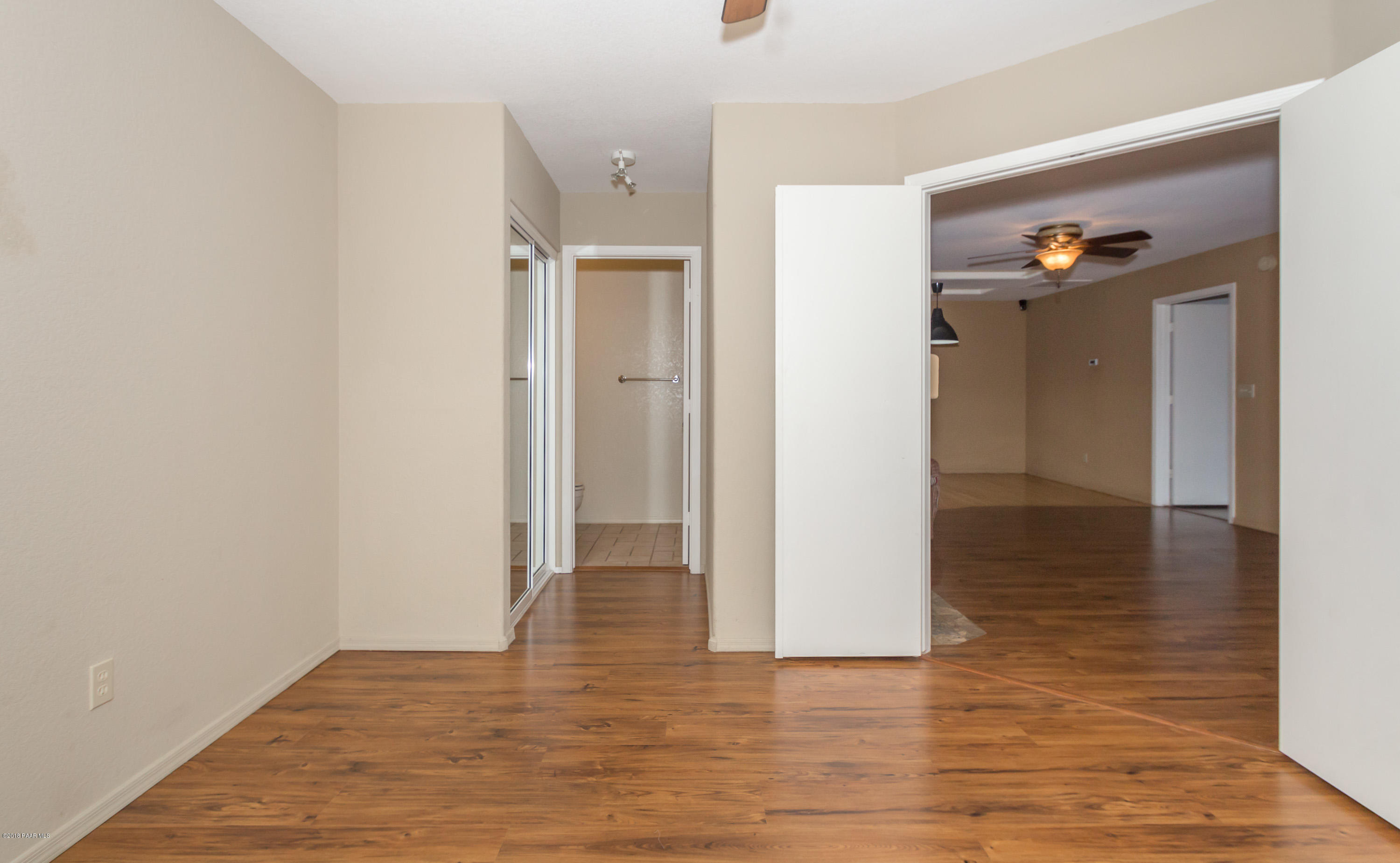 3059 Smokey Road, Unit 21B Prescott, AZ 86301 - Photo 8 of 21 a view of a hallway with wooden floor