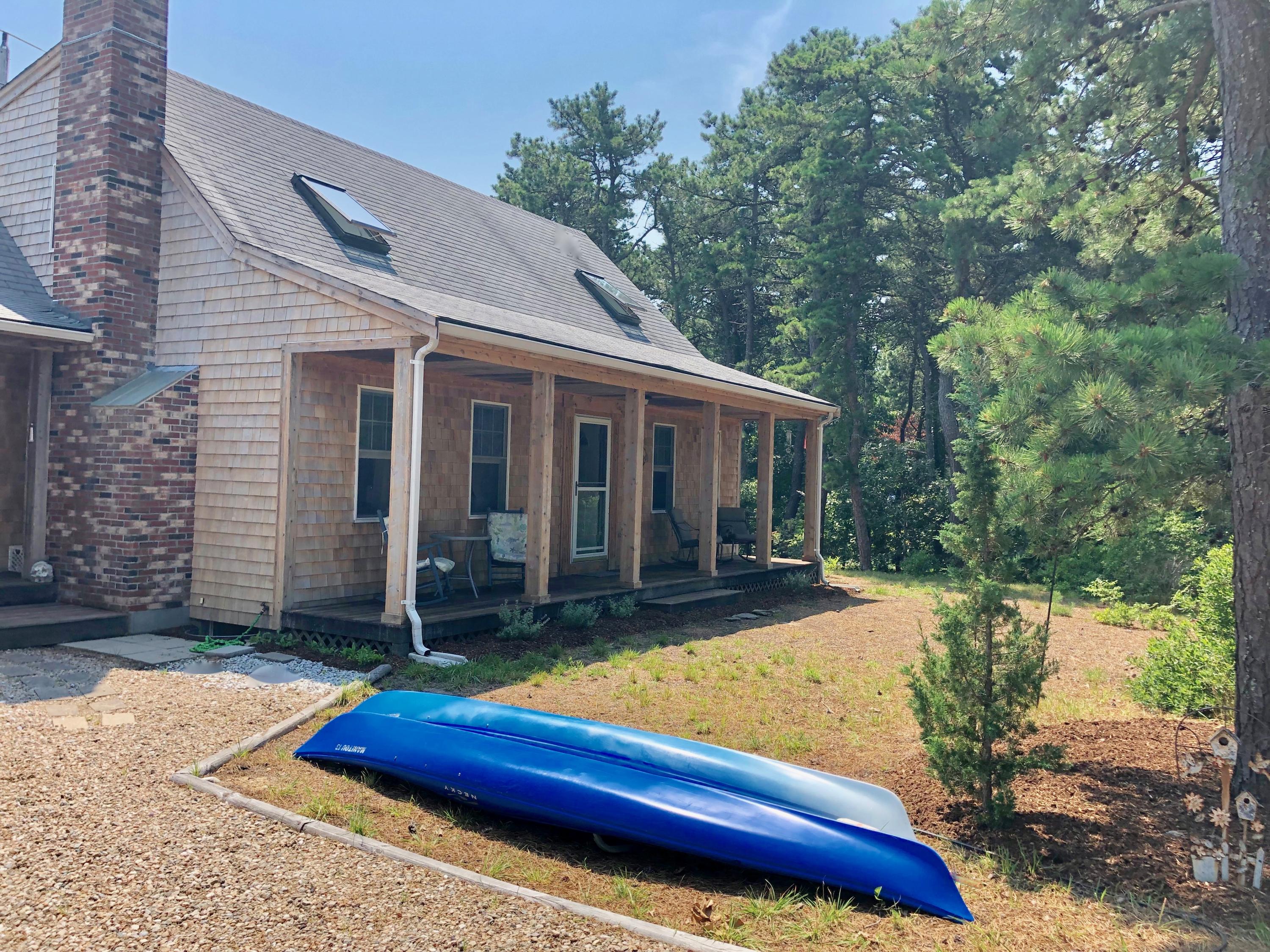 90 Jennie Clark Road Eastham, MA 02642 - Photo 1 of 35 a view of house with yard nad seating space