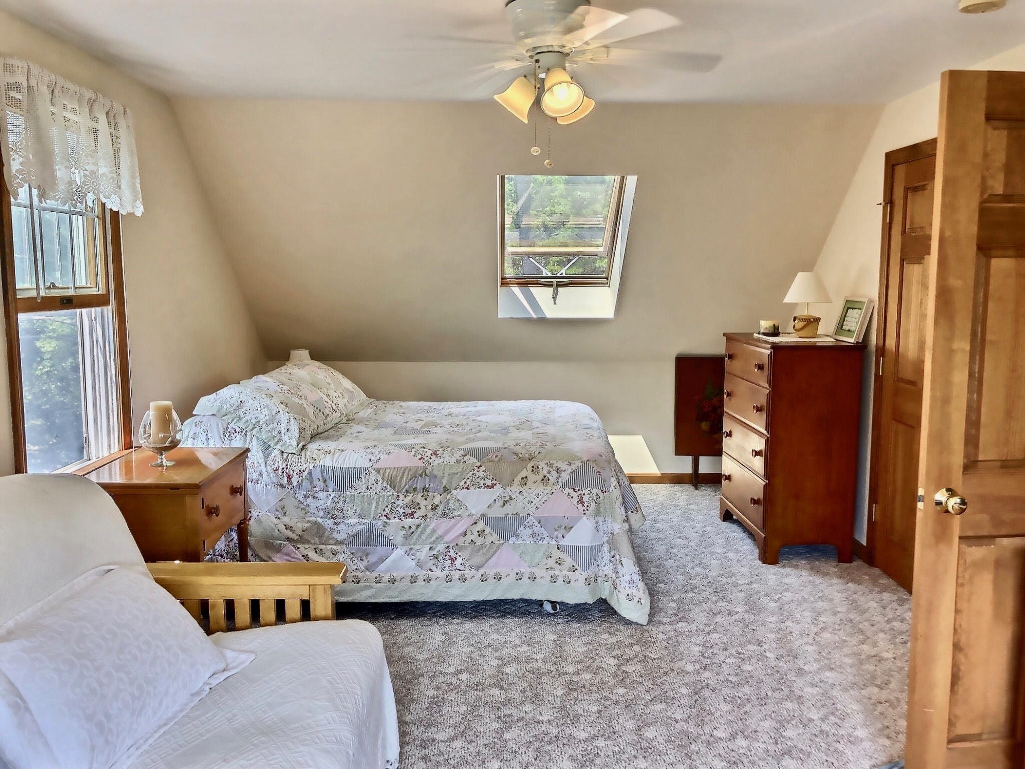 90 Jennie Clark Road Eastham, MA 02642 - Photo 17 of 35 a bedroom with a bed dresser and a window