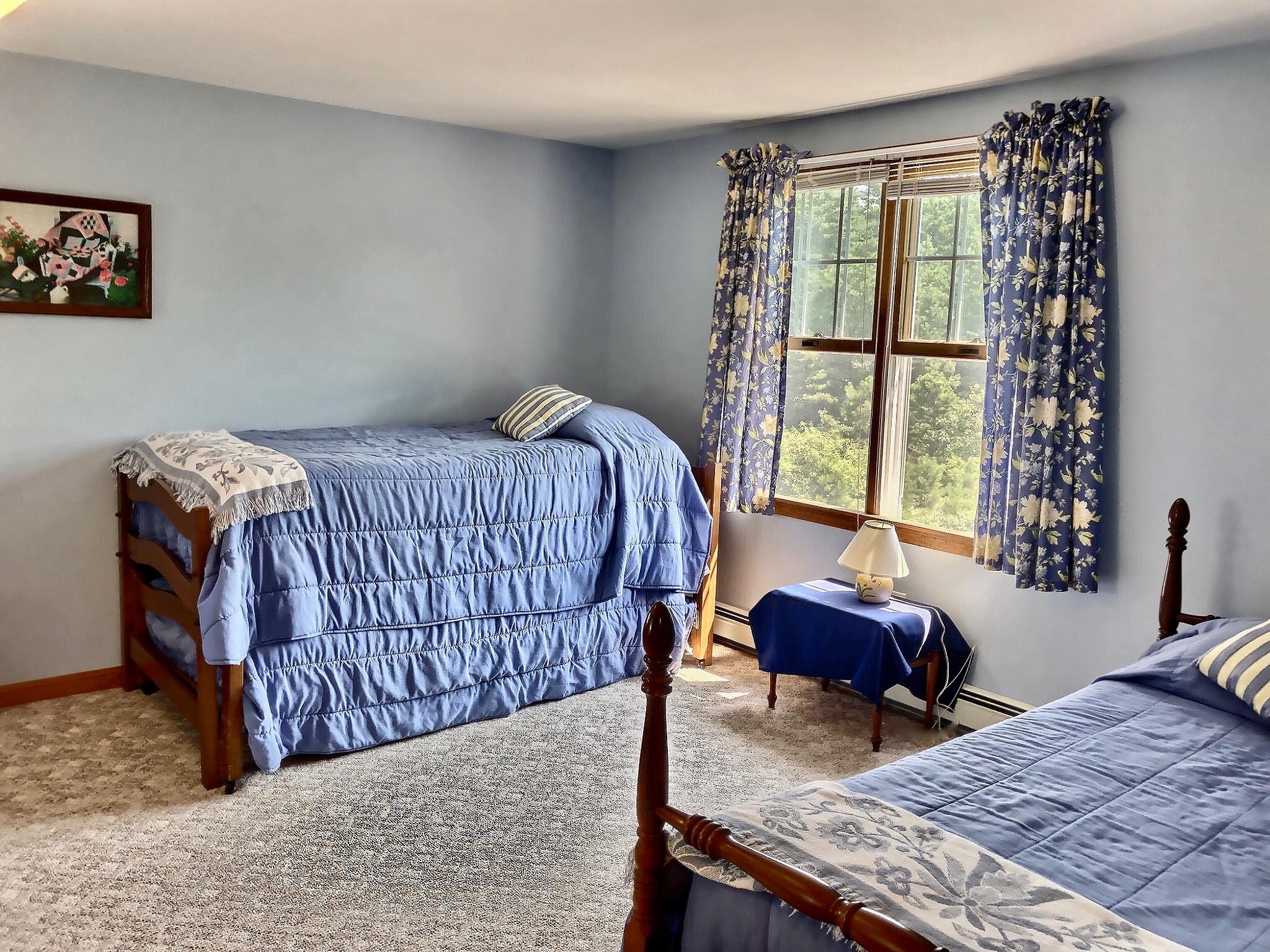 90 Jennie Clark Road Eastham, MA 02642 - Photo 23 of 35 a bed sitting in a bedroom next to a window