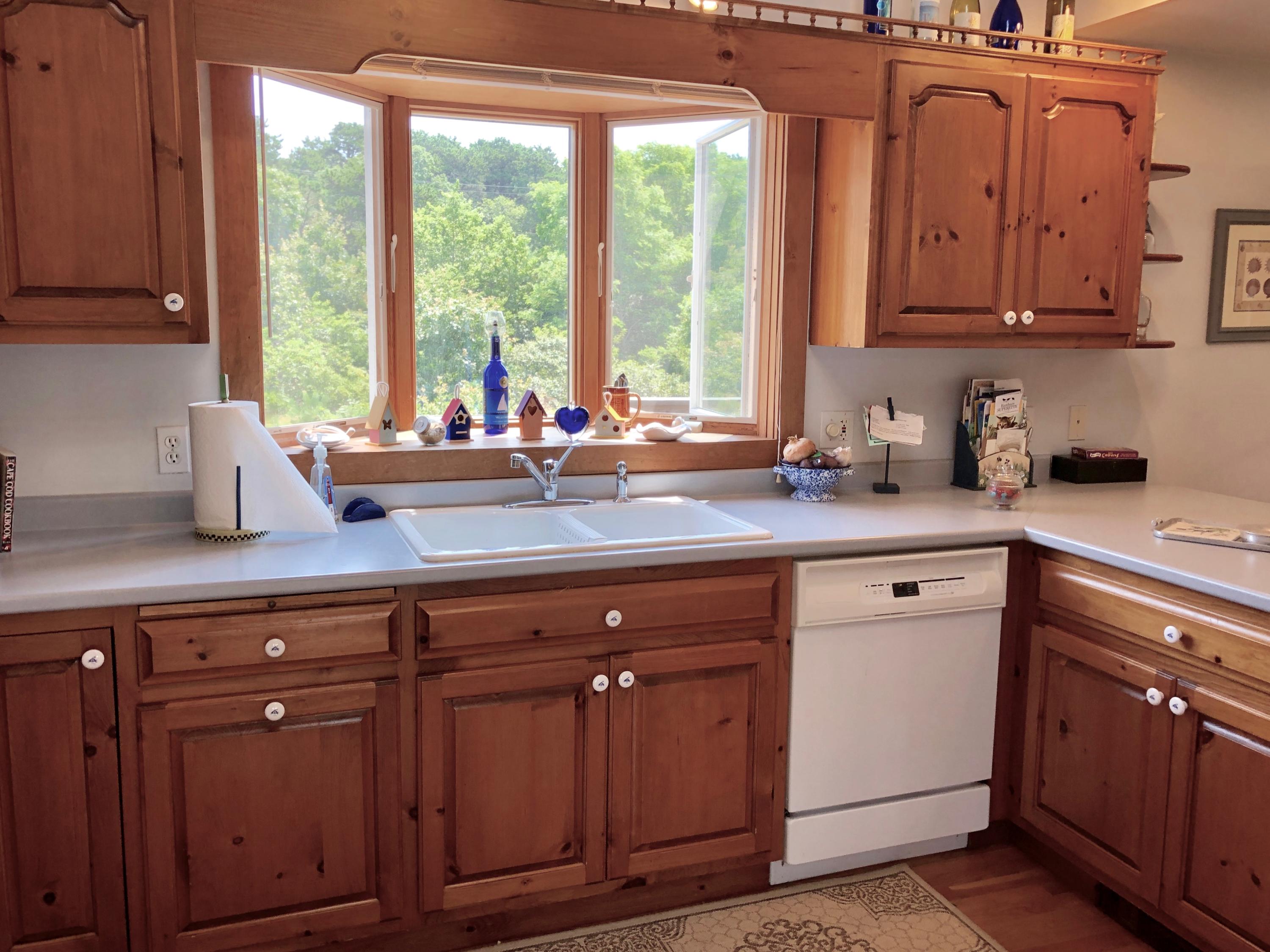 90 Jennie Clark Road Eastham, MA 02642 - Photo 25 of 35 a kitchen with sink cabinets and window