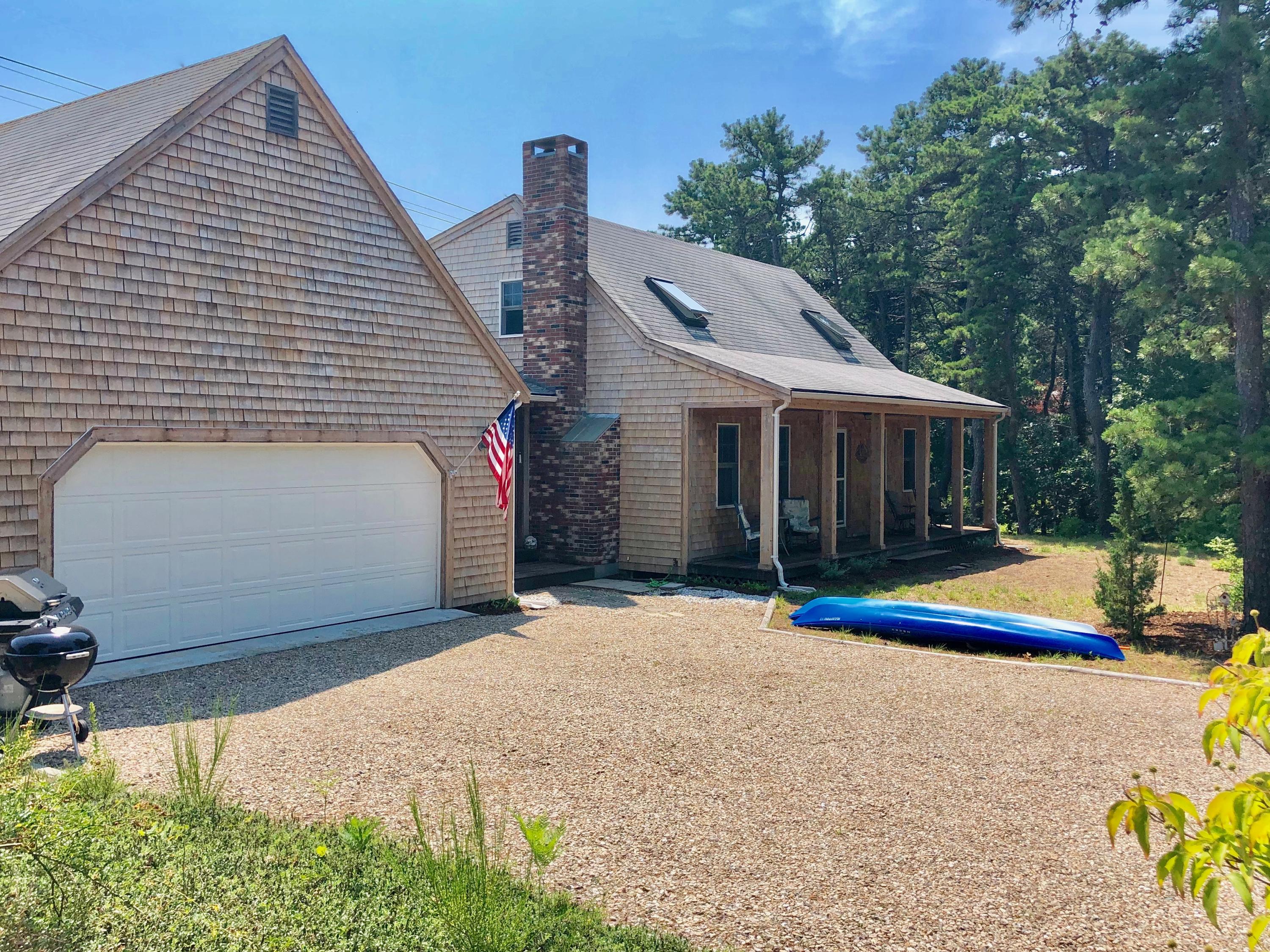 90 Jennie Clark Road Eastham, MA 02642 - Photo 3 of 35 a view of a house with pool and a yard