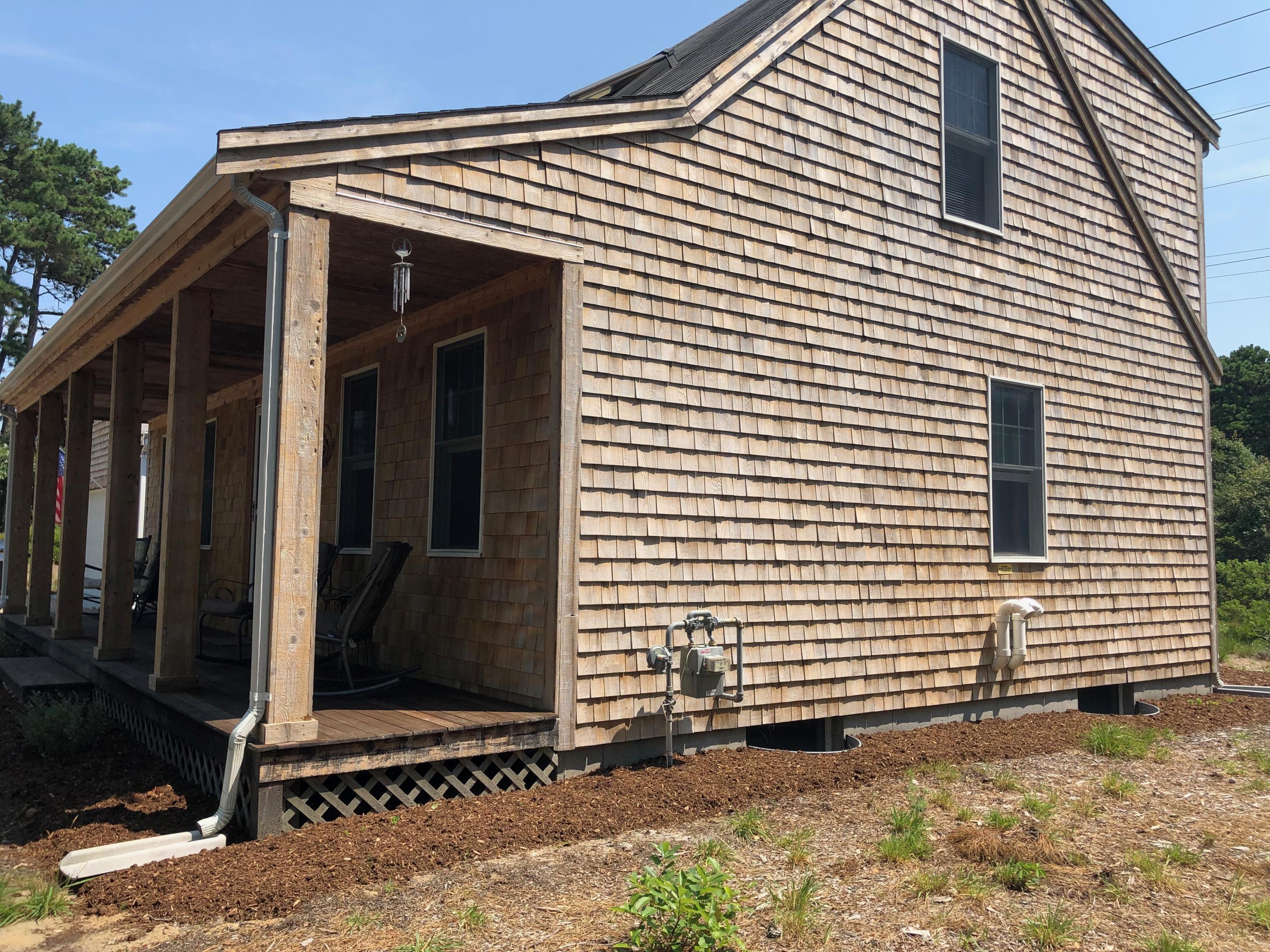 90 Jennie Clark Road Eastham, MA 02642 - Photo 33 of 35 a view of a small house with wooden fence