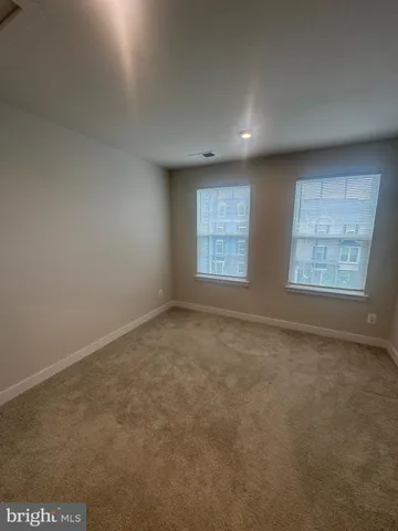 a view of a livingroom with windows
