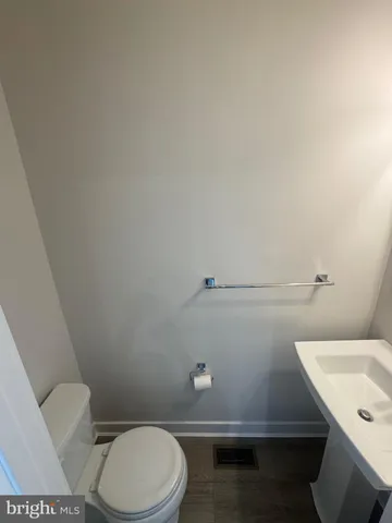 a bathroom with a double vanity sink toilet and shower