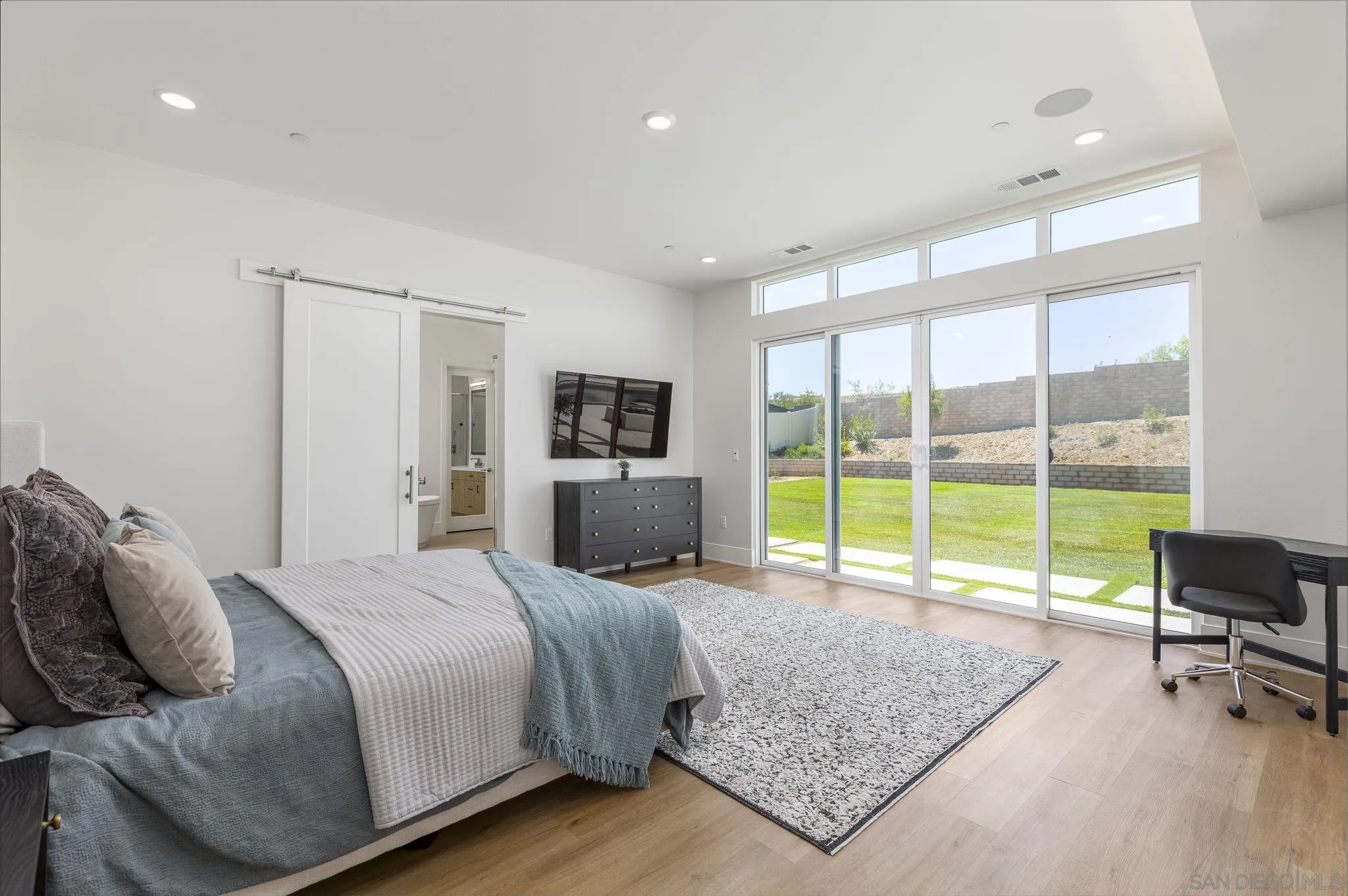 32213 Daybrook Terrace Temecula, CA 92591 - Photo 8 of 23 a bedroom with a bed a couch and large window with outer view