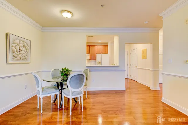 a workspace room with furniture and wooden floor