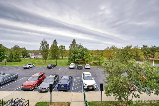 an aerial view of a house with garden space and lake view