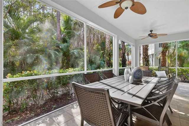 a view of an outdoor dining space with furniture and wooden floor