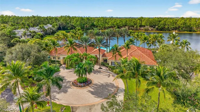 an aerial view of residential house with outdoor space and lake view