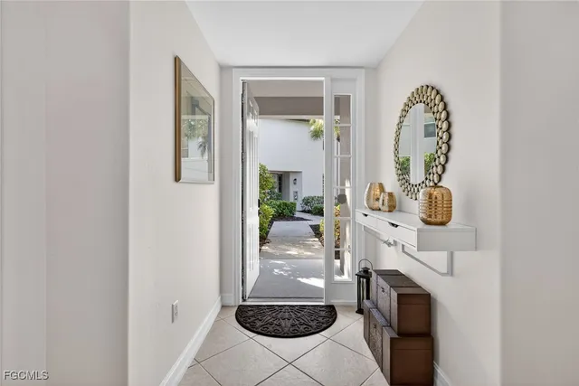 a room with a fireplace and rug