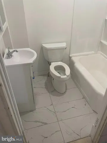 a bathroom with a sink and a toilet