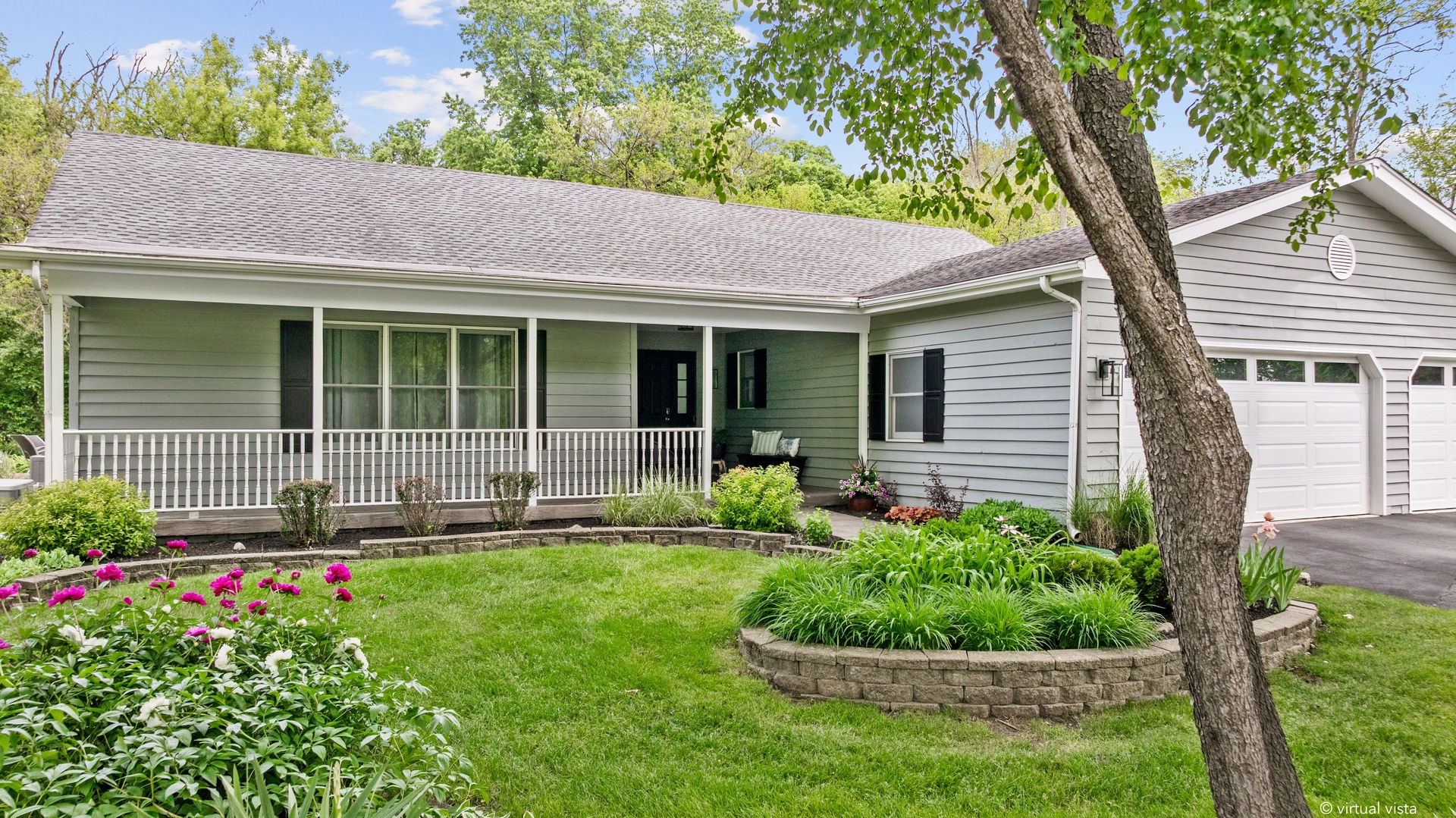 28W140 Mack Road Wheaton, IL 60189 - Photo 4 of 48 a front view of a house with a yard and potted plants