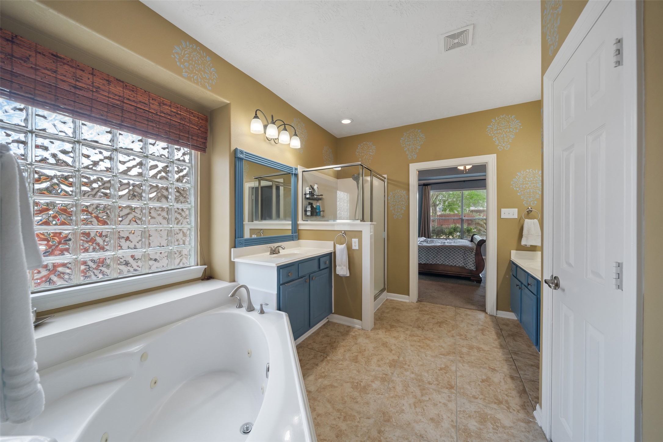 6407 Ashley Manor Drive Spring, TX 77389 - Photo 21 of 41 a bathroom with a tub sink vanity and balcony