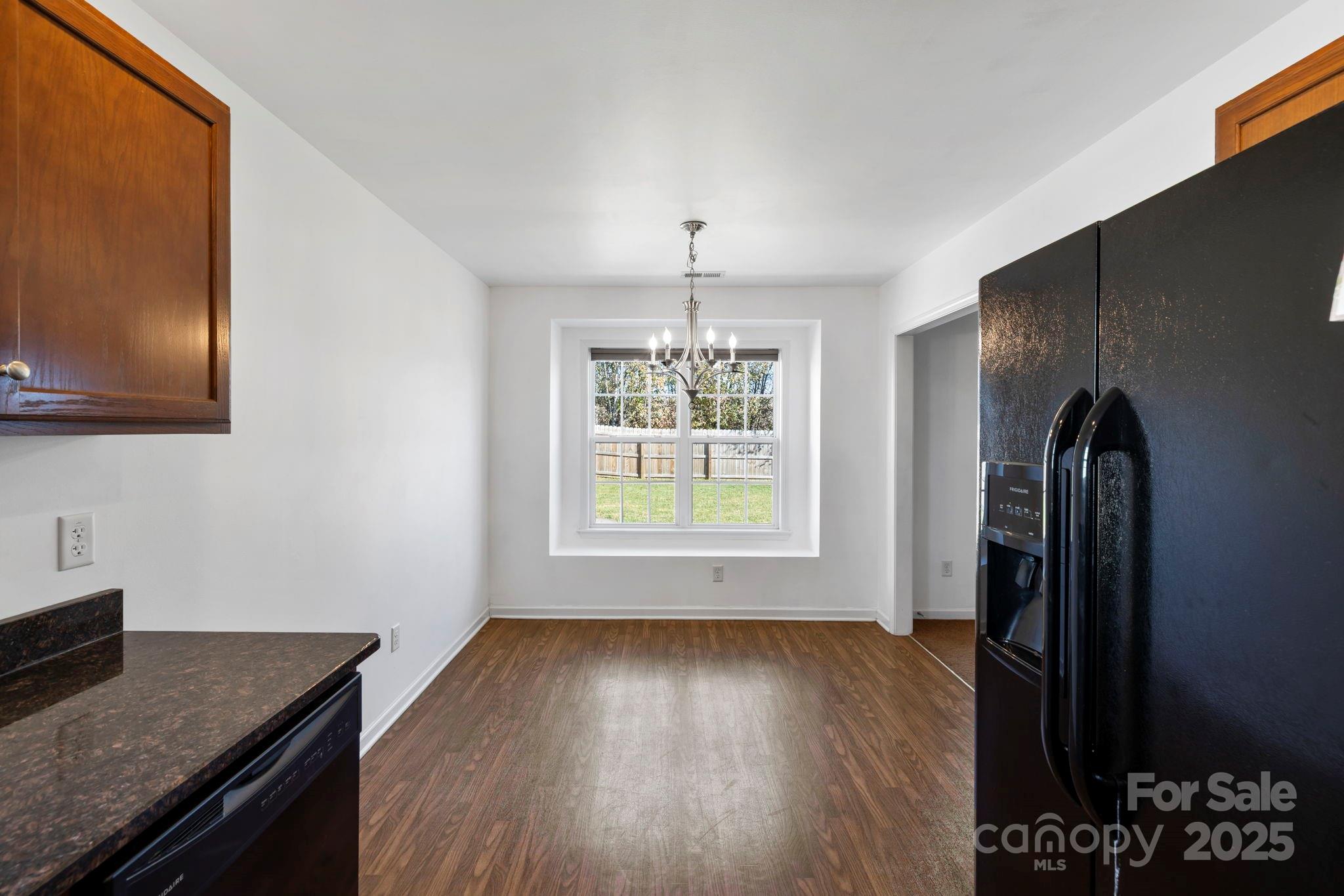 284 Mud Creek Road Fletcher, NC 28732 - Photo 11 of 31 wooden floor in an empty room with a window