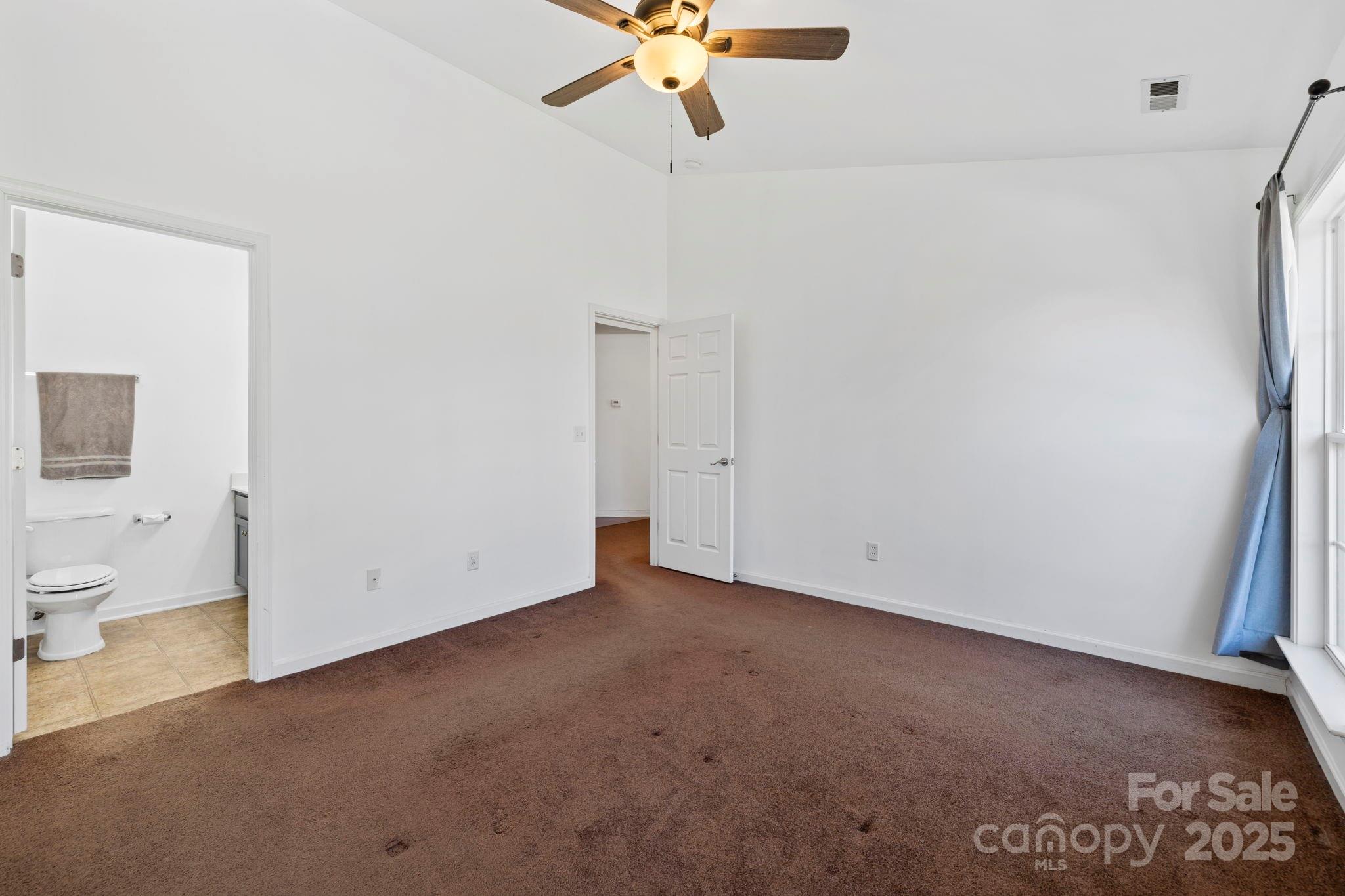 284 Mud Creek Road Fletcher, NC 28732 - Photo 16 of 36 a view of an empty room with a window