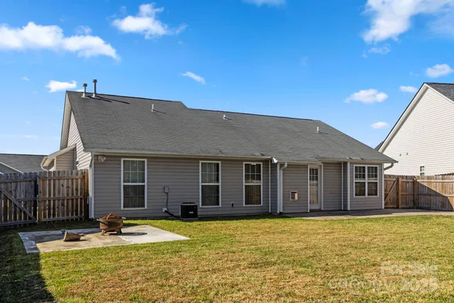 a house with swimming pool in front of it