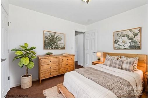284 Mud Creek Road Fletcher, NC 28732 - Photo 23 of 36 a bedroom with a bed and a painting on the wall