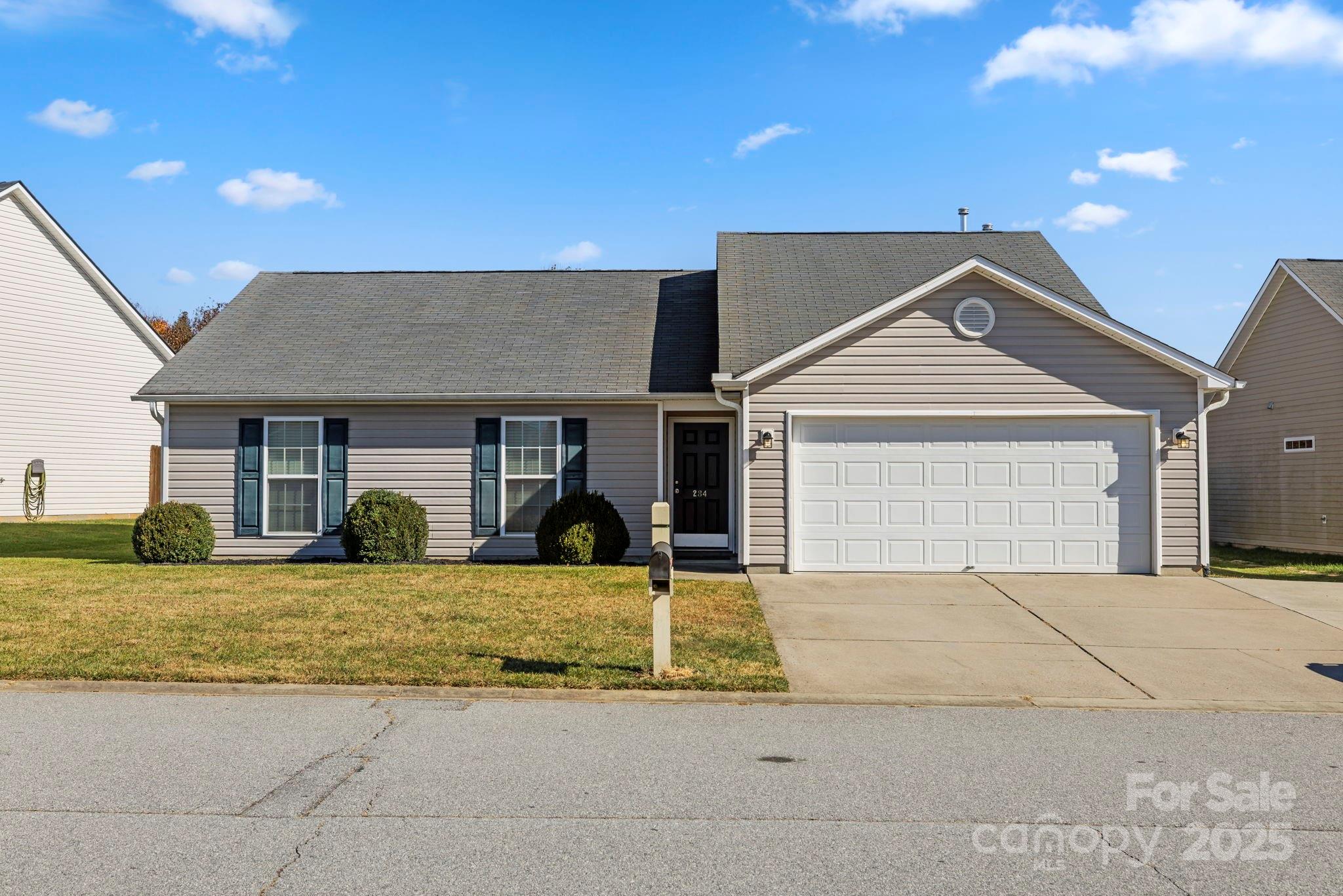 284 Mud Creek Road Fletcher, NC 28732 - Photo 3 of 31 a front view of a house with garden