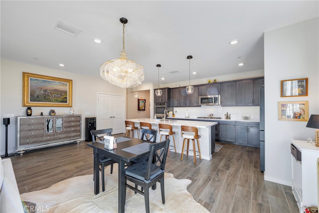 79244 Zamora Court Indio, CA 92203 - Photo 14 of 52 a large kitchen with a table and chairs in it