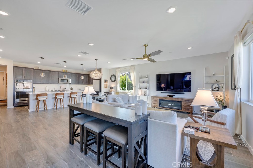 79244 Zamora Court Indio, CA 92203 - Photo 17 of 52 a view of a dining room with furniture window and wooden floor