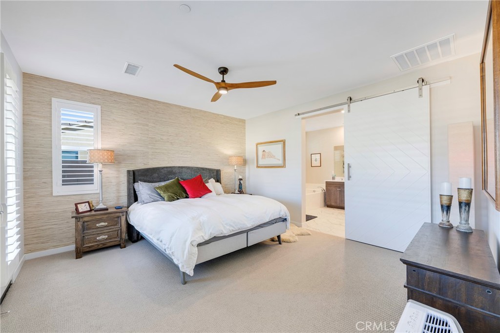 79244 Zamora Court Indio, CA 92203 - Photo 21 of 52 a spacious bedroom with a bed and a table