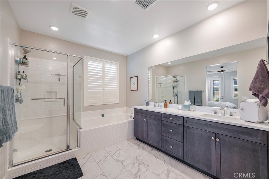 79244 Zamora Court Indio, CA 92203 - Photo 26 of 52 a spacious bathroom with a shower sink mirror and