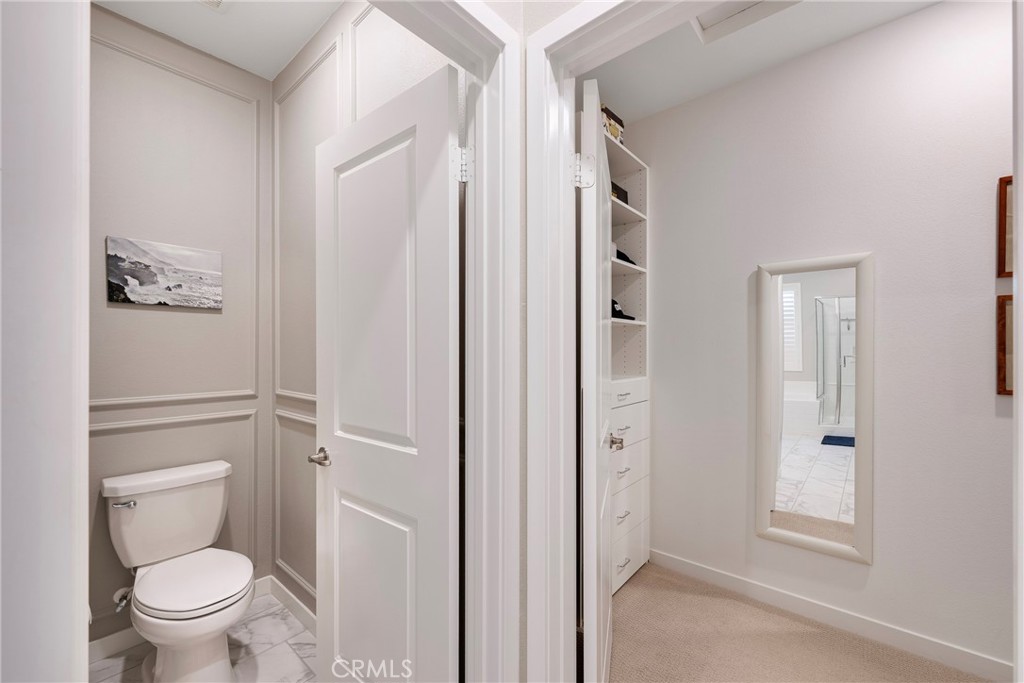 79244 Zamora Court Indio, CA 92203 - Photo 28 of 52 a bathroom with a granite countertop toilet a sink and shower