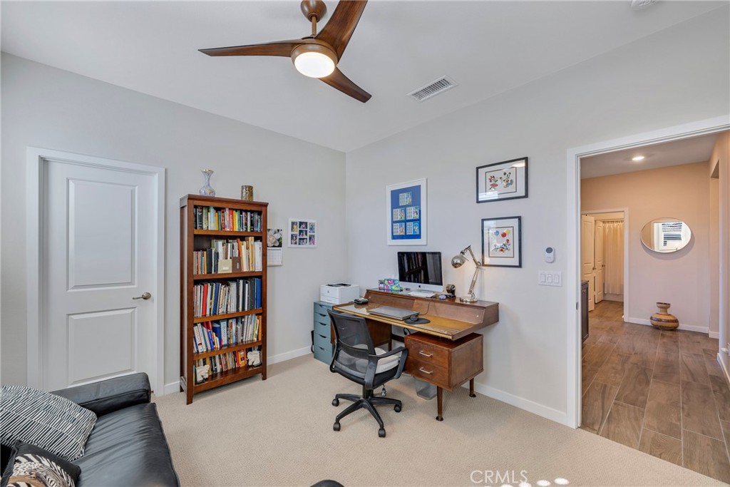 79244 Zamora Court Indio, CA 92203 - Photo 33 of 52 a view of a livingroom with workspace and a window