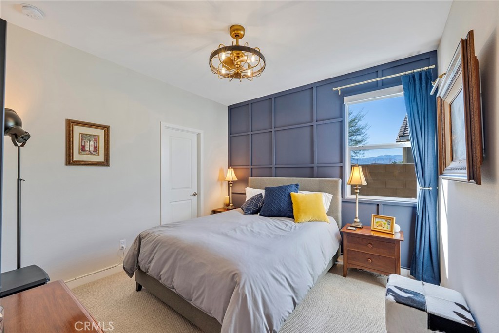 79244 Zamora Court Indio, CA 92203 - Photo 34 of 52 a bedroom with a bed and a painting on the wall