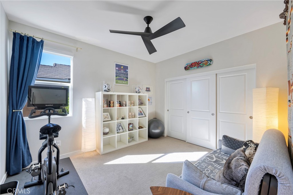 79244 Zamora Court Indio, CA 92203 - Photo 36 of 52 a living room with furniture a flat screen tv and a window
