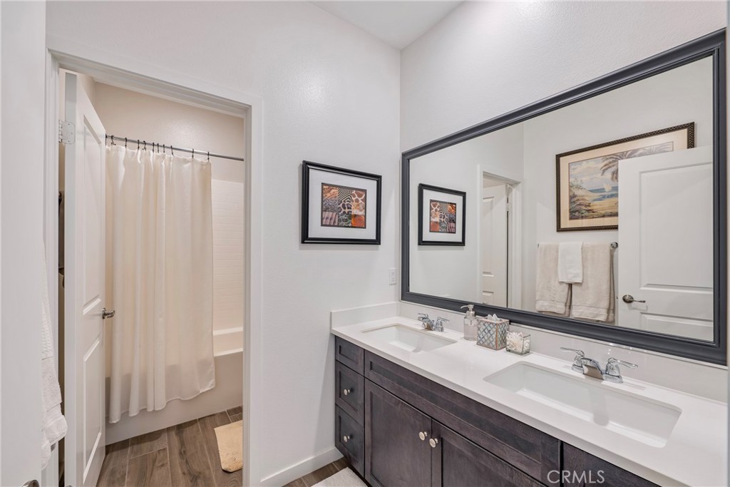 79244 Zamora Court Indio, CA 92203 - Photo 38 of 52 a bathroom with double vanity sink and a mirror