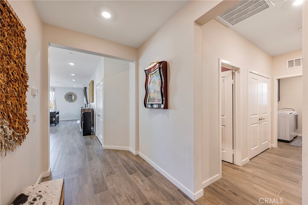79244 Zamora Court Indio, CA 92203 - Photo 40 of 52 a view of a hallway with wooden floor and closet