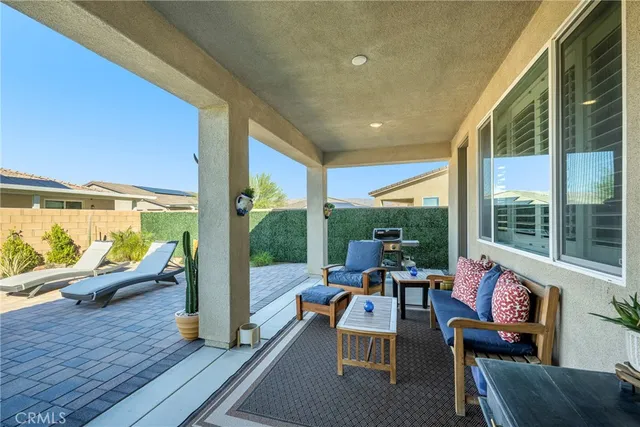 a outdoor space with patio the couches and a dining table with garden view